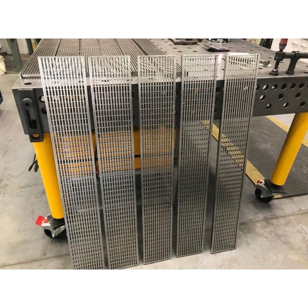 Custom commercial heel guard grate drains.