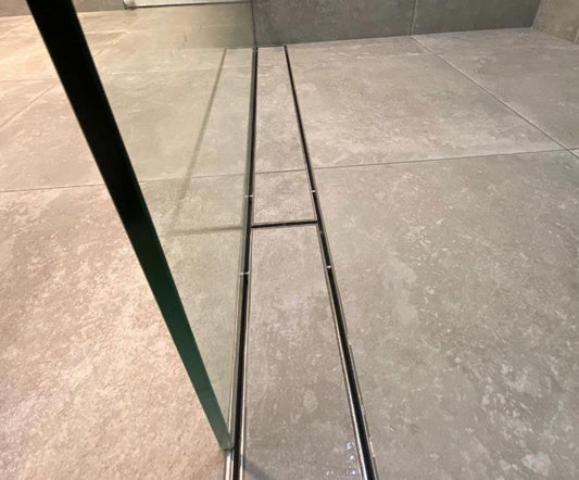 Linear Shower Grate position in shower.