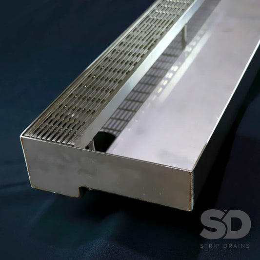 Threshold drain manufactured from 100% Stainless Steel with a grate.